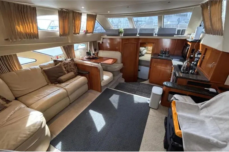 Slide: The Image of Luxurious interior of 2005 Carver 41 Cockpit Motor Yacht with plush seating and elegant decor. - 2