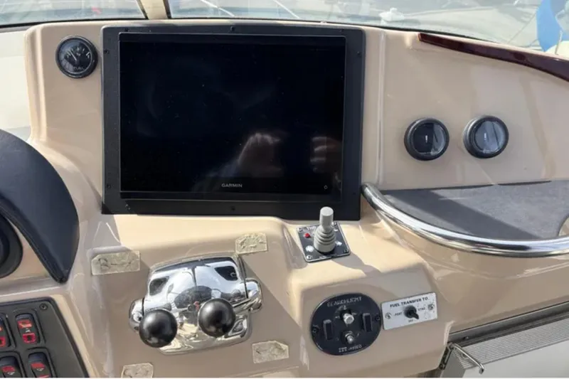 Slide: The Image of Control panel of a 2005 Carver 41 Cockpit Motor Yacht with navigation screen. - 5