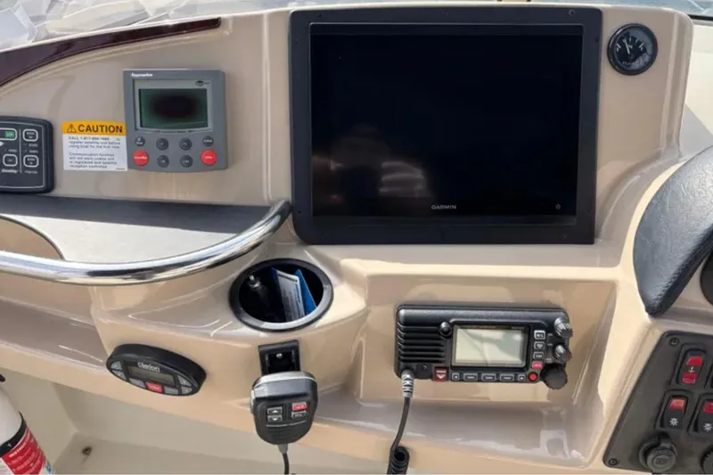 Slide: The Image of Control panel of 2005 Carver 41 Cockpit Motor Yacht with navigation and communication equipment. - 7