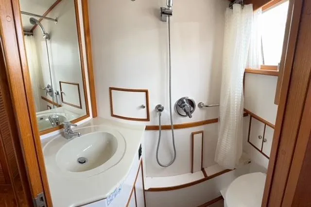 Slide: The Image of Bathroom interior of 2000 Grand Banks 36 Classic yacht with shower and sink. - 12