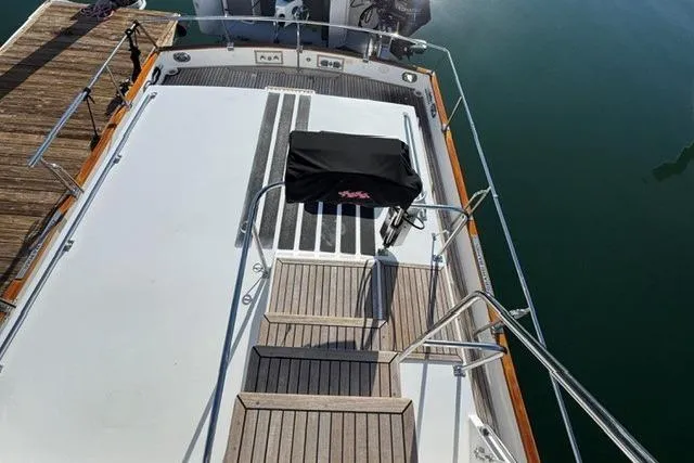 Slide: The Image of Grand Banks 36 Classic 2000 yacht deck with wooden steps and railing. - 18