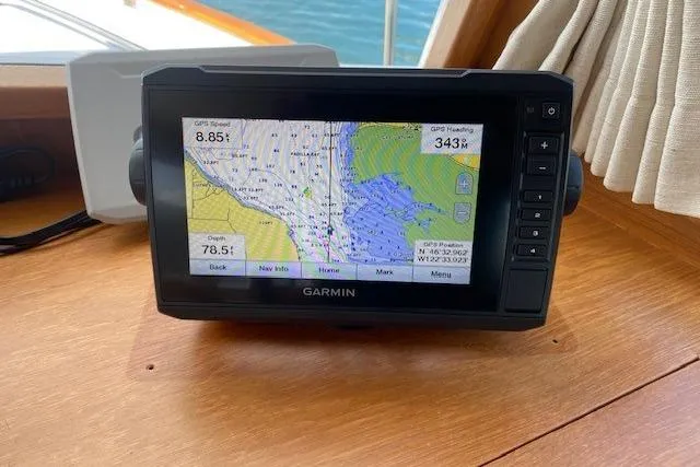 Slide: The Image of Garmin GPS device on 2000 Grand Banks 36 Classic boat, displaying nautical map and navigation data. - 4