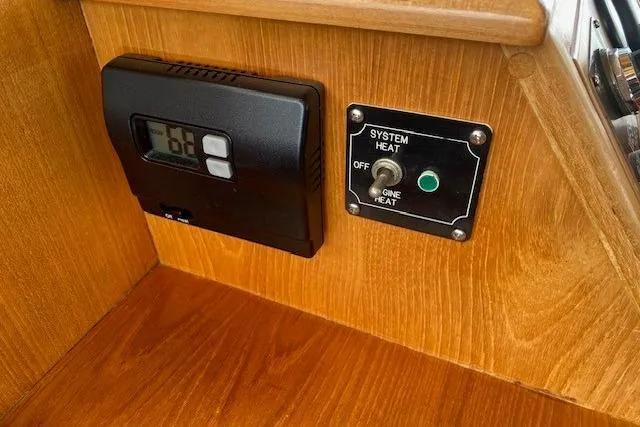 Slide: The Image of Thermostat and system heat control panel on 2000 Grand Banks 36 Classic yacht. - 6