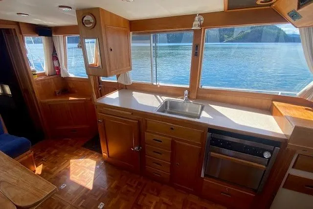 Slide: The Image of Interior of 2000 Grand Banks 36 Classic yacht with wooden cabinetry and scenic water view. - 8