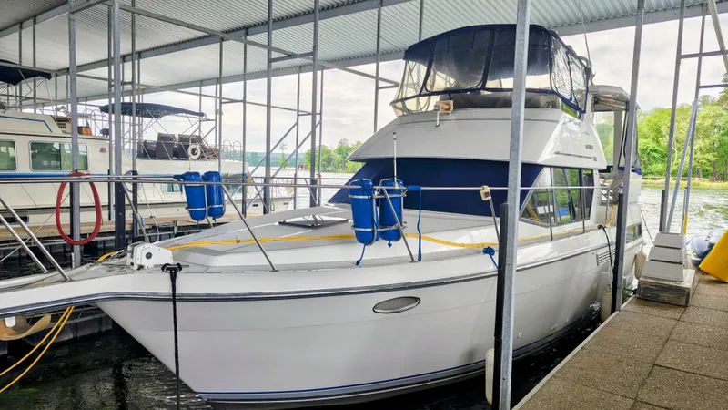 The Image of 1992 Carver 33 Aft Cabin yacht docked, side view. - 0
