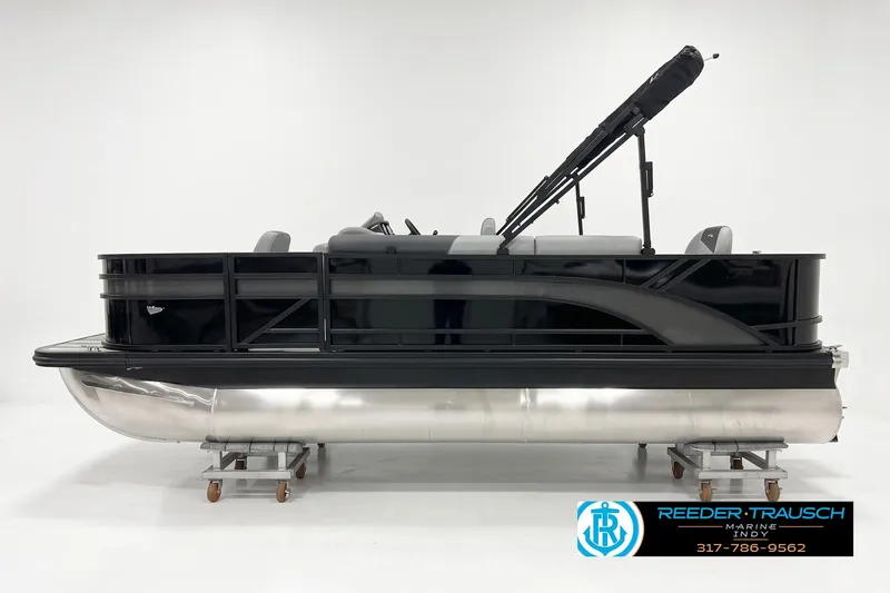 The Image of 2026 Bennington 188 SF pontoon boat in sleek black, displayed in a showroom. - 1