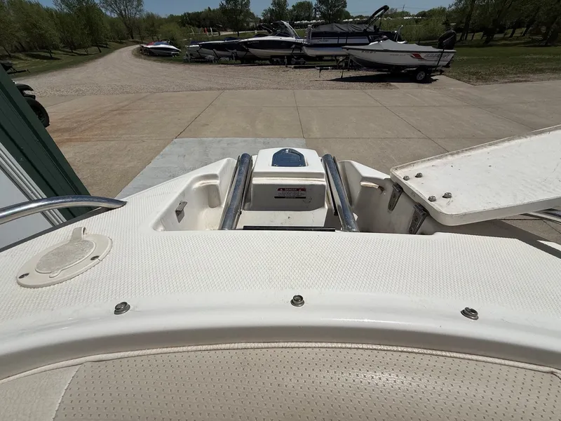 Slide: The Image of 2004 Chaparral 256 SSi boat on a parking lot. - 10