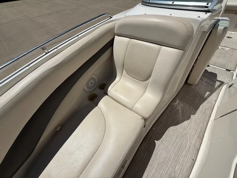 Slide: The Image of Interior of a 2004 Chaparral 256 SSi boat with beige seating. - 11