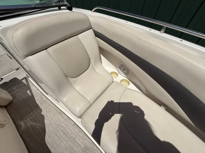 Slide: The Image of Interior of a 2004 Chaparral 256 SSi boat with beige seating. - 12