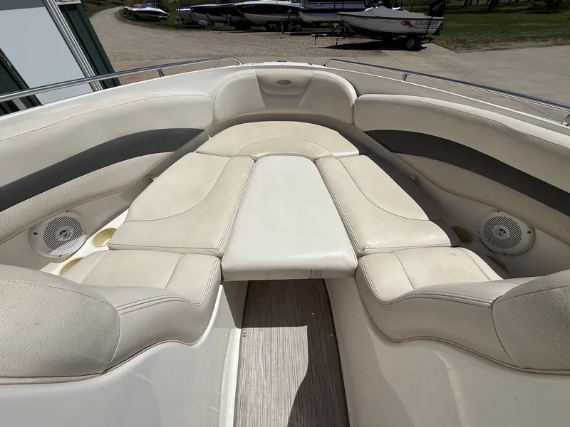 Slide: The Image of Interior of a 2004 Chaparral 256 SSi boat with beige seating. - 13