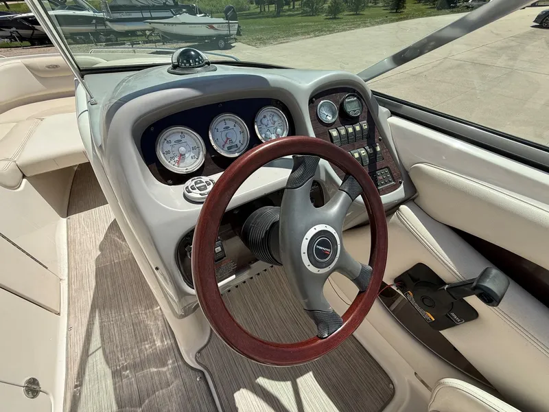 Slide: The Image of Interior view of a 2004 Chaparral 256 SSi boat cockpit. - 14