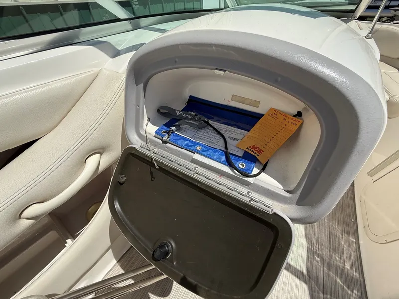 Slide: The Image of Interior of a 2004 Chaparral 256 SSi with storage compartment. - 17