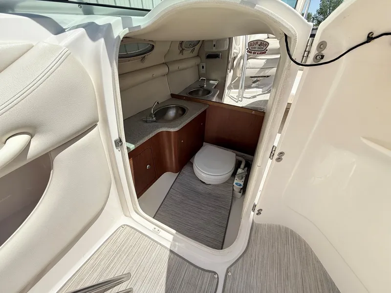 Slide: The Image of Interior of 2004 Chaparral 256 SSi with toilet and sink. - 18