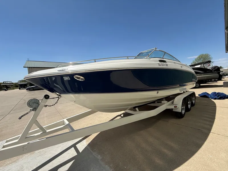 Slide: The Image of 2004 Chaparral 256 SSi boat on trailer outdoors. - 2