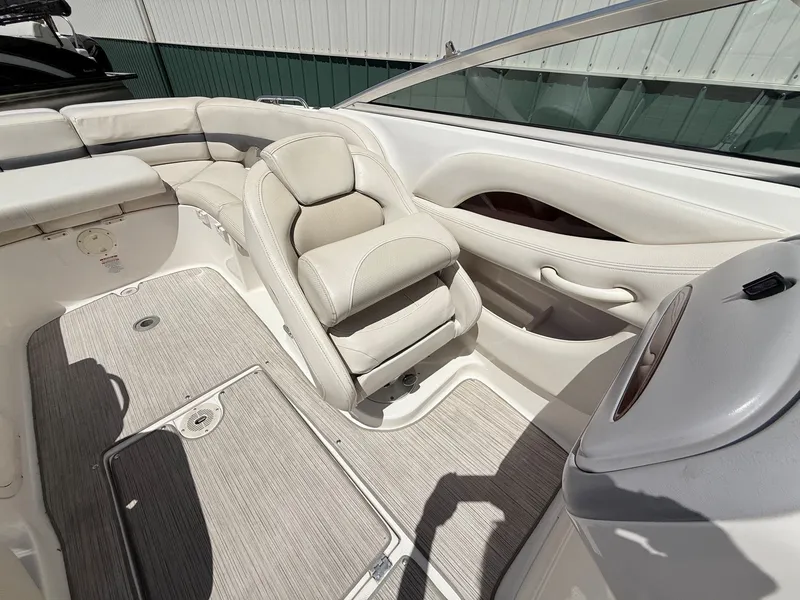 Slide: The Image of Interior of a 2004 Chaparral 256 SSi boat with beige seating. - 20