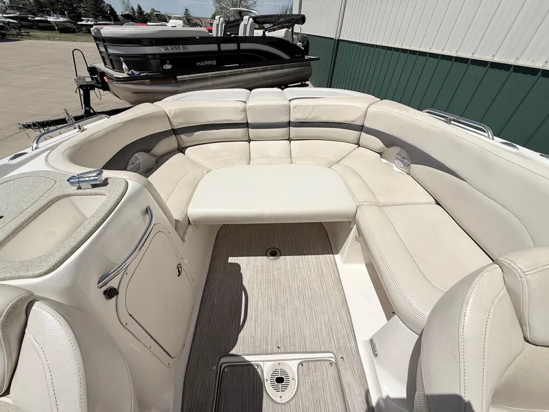 Slide: The Image of Interior of a 2004 Chaparral 256 SSi boat with beige seating. - 21