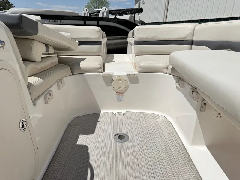Slide: The Image of Interior of a 2004 Chaparral 256 SSi boat with white seating. - 23