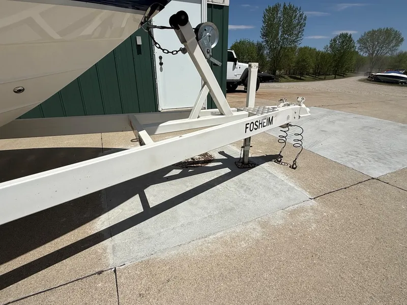 Slide: The Image of Boat trailer with Chaparral 256 SSi, 2004, on concrete surface. - 29