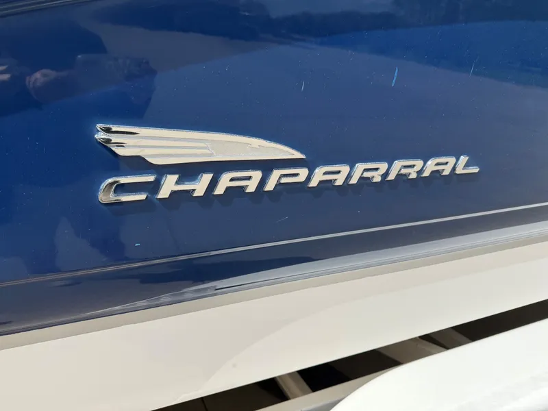 Slide: The Image of Close-up of Chaparral 256 SSi logo on blue background. - 3