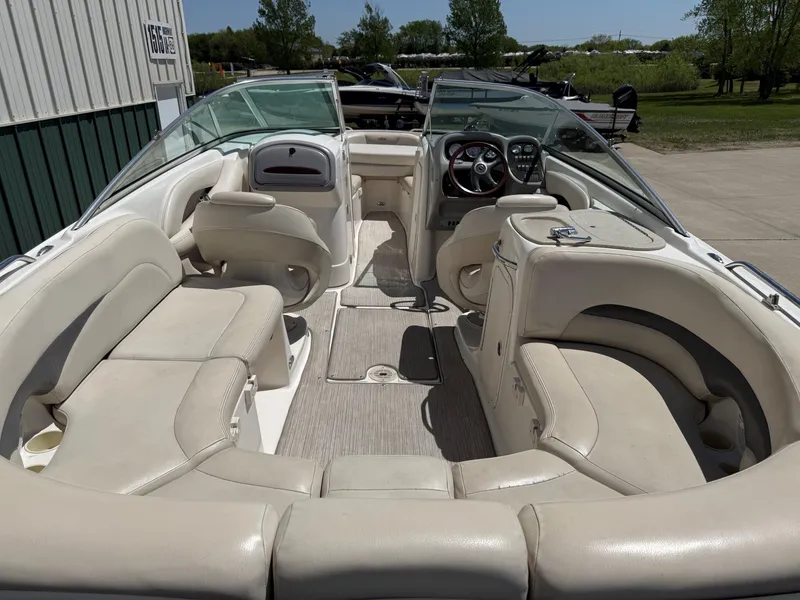 Slide: The Image of Interior of a 2004 Chaparral 256 SSi boat with beige seating. - 8