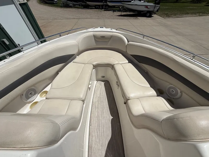 Slide: The Image of Interior of a 2004 Chaparral 256 SSi boat with beige seating. - 9