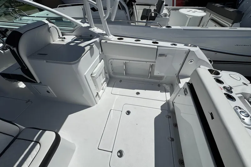 Slide: The Image of 2026 Stingray 259 DC boat interior with seating and storage compartments. - 14