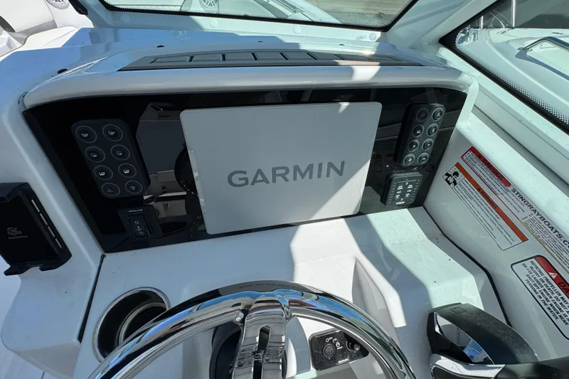 Slide: The Image of Dashboard of 2026 Stingray 259 DC boat featuring Garmin navigation system. - 21
