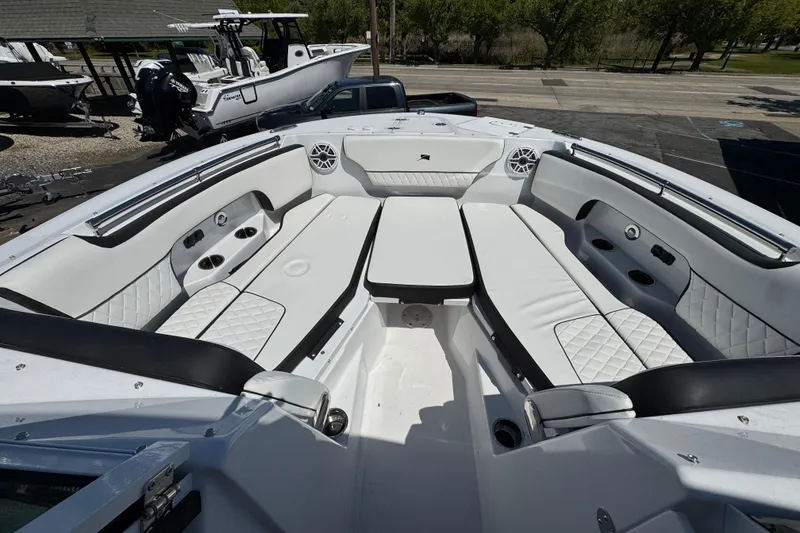 Slide: The Image of 2026 Stingray 259 DC boat interior with white seating and modern design. - 29