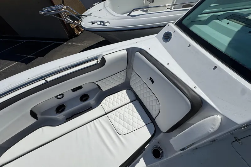 Slide: The Image of Interior view of 2026 Stingray 259 DC boat, featuring white quilted seating and sleek design. - 35