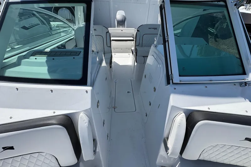 Slide: The Image of 2026 Stingray 259 DC boat interior with sleek seating and modern design. - 36