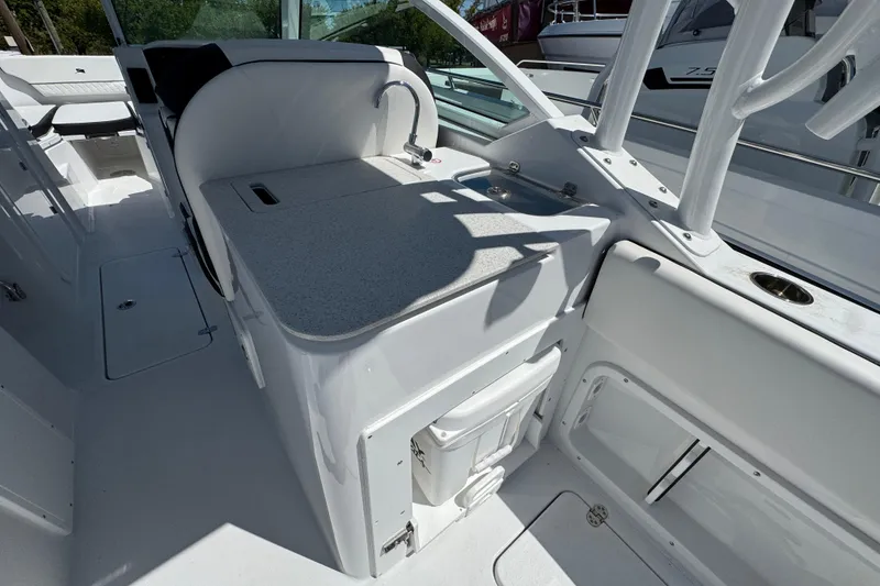 Slide: The Image of 2026 Stingray 259 DC boat interior with sleek white design and modern amenities. - 8