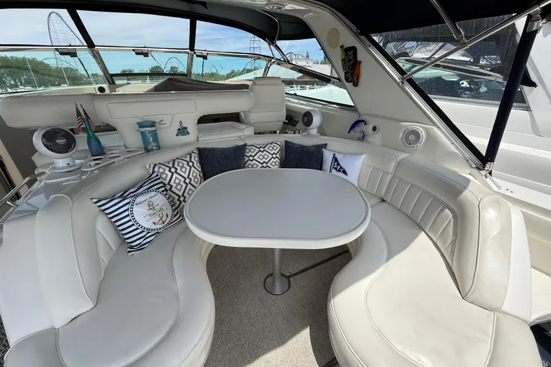 Slide: The Image of Luxurious interior of a 1998 Sea Ray 500 Sundancer yacht with plush seating and decor. - 13