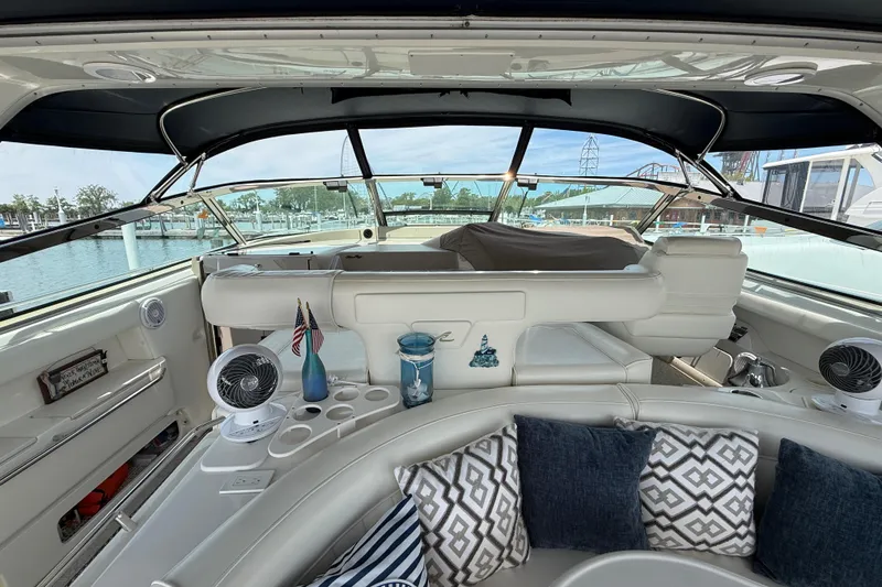 Slide: The Image of Interior view of a 1998 Sea Ray 500 Sundancer yacht with plush seating and nautical decor. - 15