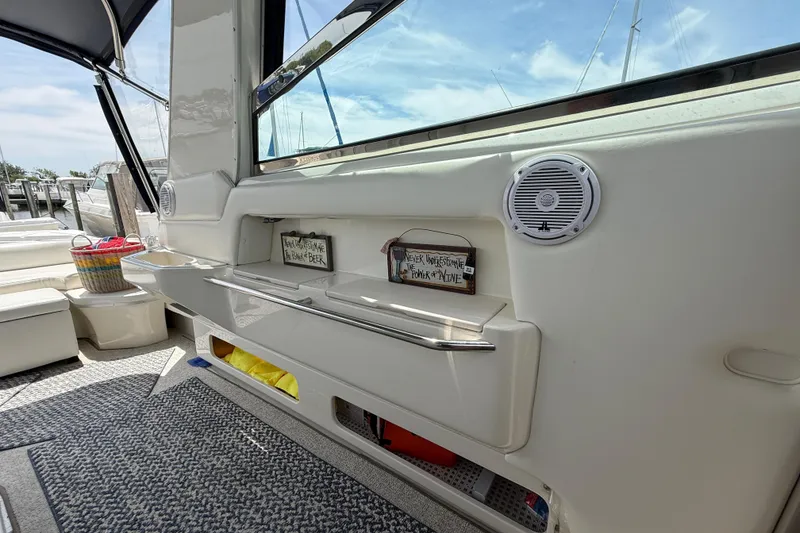 Slide: The Image of Interior of a 1998 Sea Ray 500 Sundancer yacht with speaker and storage. - 19
