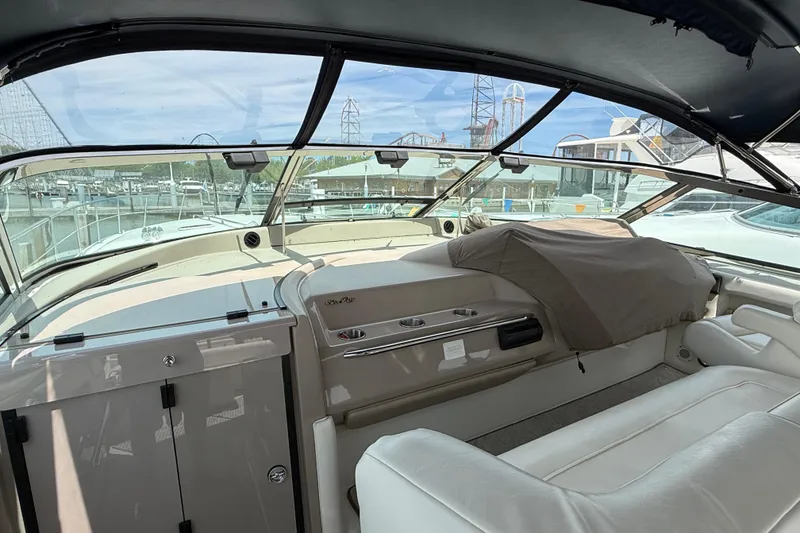 Slide: The Image of 1998 Sea Ray 500 Sundancer yacht interior with helm and seating area. - 21