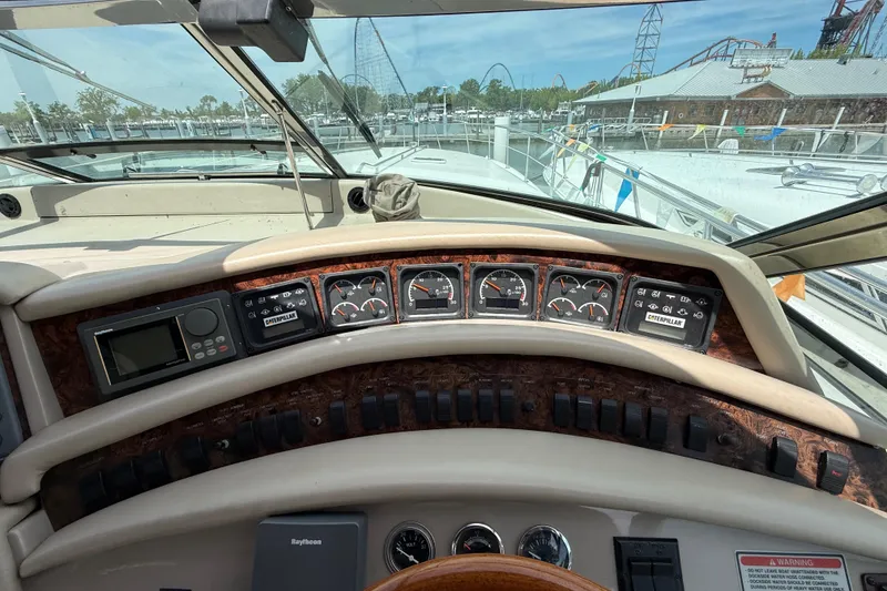 Slide: The Image of Cockpit view of 1998 Sea Ray 500 Sundancer with control panel and gauges. - 26