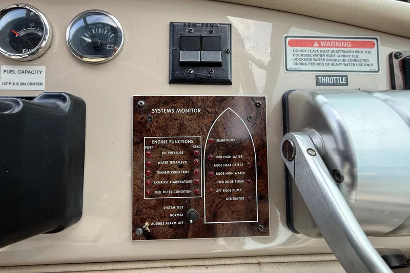 Slide: The Image of Control panel of a 1998 Sea Ray 500 Sundancer boat with system monitor and gauges. - 30