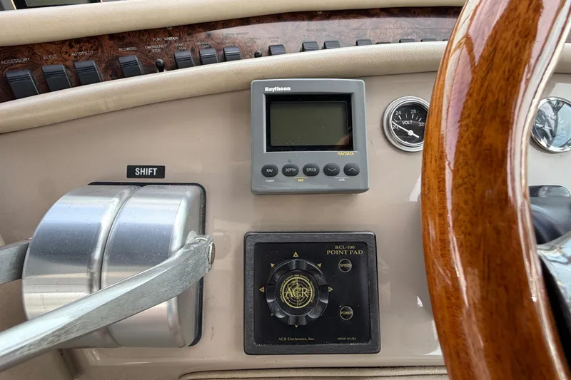 Slide: The Image of Control panel of a 1998 Sea Ray 500 Sundancer boat with navigation instruments. - 32