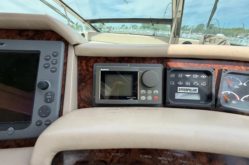 Slide: The Image of Control panel of a 1998 Sea Ray 500 Sundancer boat with navigation and engine displays. - 33