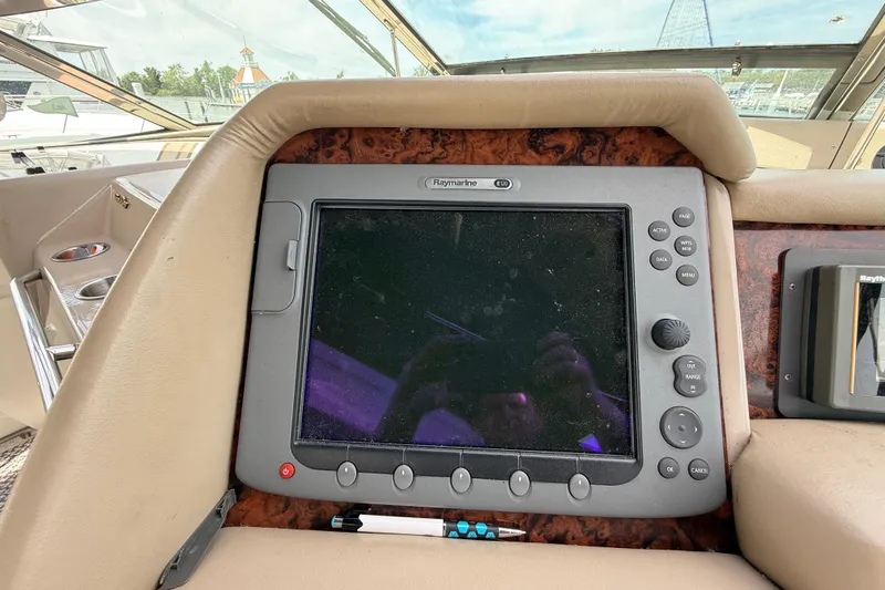 Slide: The Image of Raymarine navigation system on 1998 Sea Ray 500 Sundancer yacht dashboard. - 34