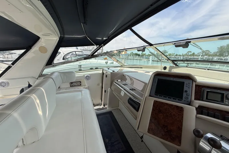 Slide: The Image of Interior view of 1998 Sea Ray 500 Sundancer yacht cockpit with navigation equipment. - 36