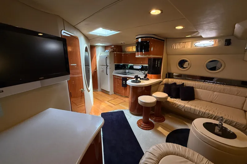 Slide: The Image of Luxurious interior of a 1998 Sea Ray 500 Sundancer yacht with modern amenities. - 38