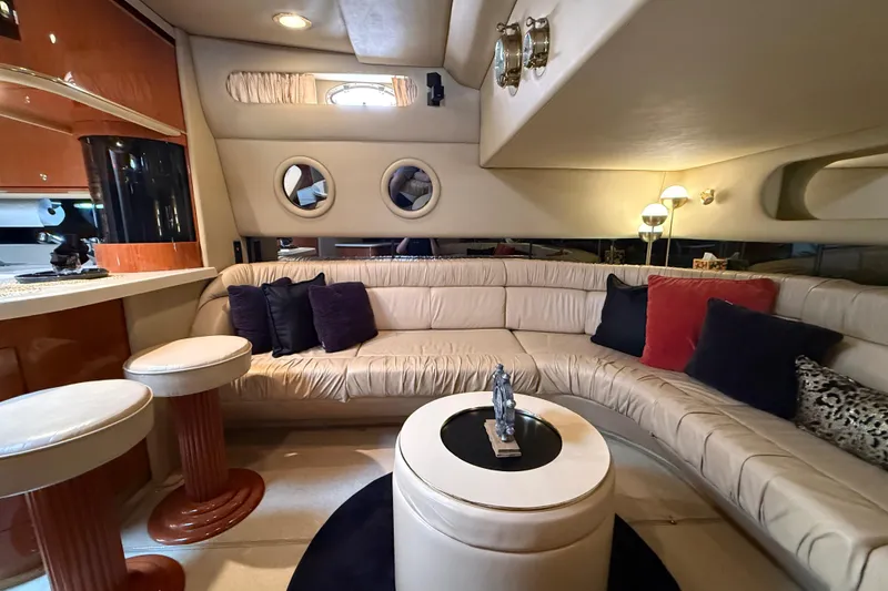 Slide: The Image of Luxurious interior of a 1998 Sea Ray 500 Sundancer yacht with plush seating and elegant decor. - 43