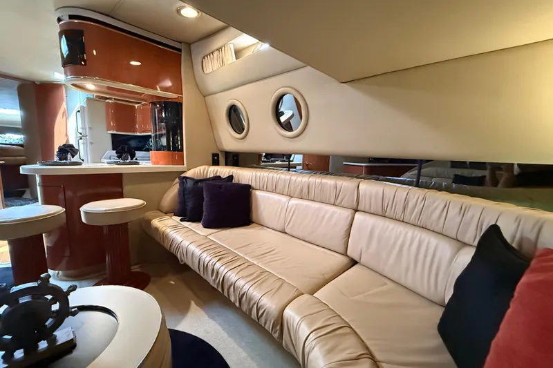 Slide: The Image of Luxurious interior of a 1998 Sea Ray 500 Sundancer yacht with plush seating and modern amenities. - 44