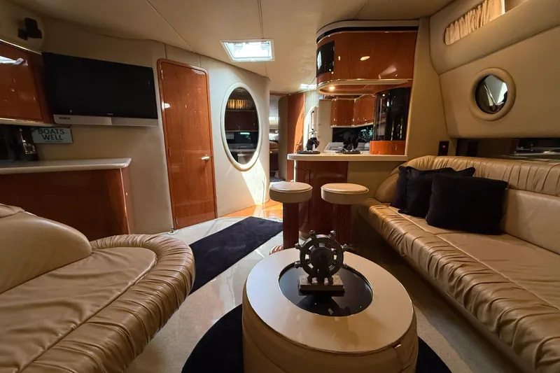 Slide: The Image of Luxurious interior of a 1998 Sea Ray 500 Sundancer yacht with elegant seating and decor. - 45