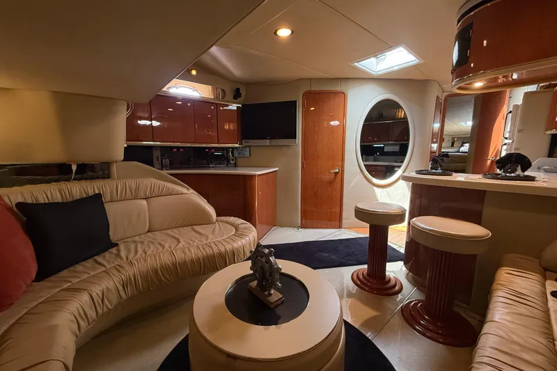Slide: The Image of Luxurious interior of a 1998 Sea Ray 500 Sundancer yacht with elegant seating and modern amenities. - 46
