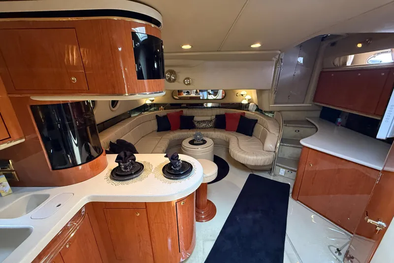 Slide: The Image of Luxurious interior of a 1998 Sea Ray 500 Sundancer yacht with elegant wood finishes. - 53