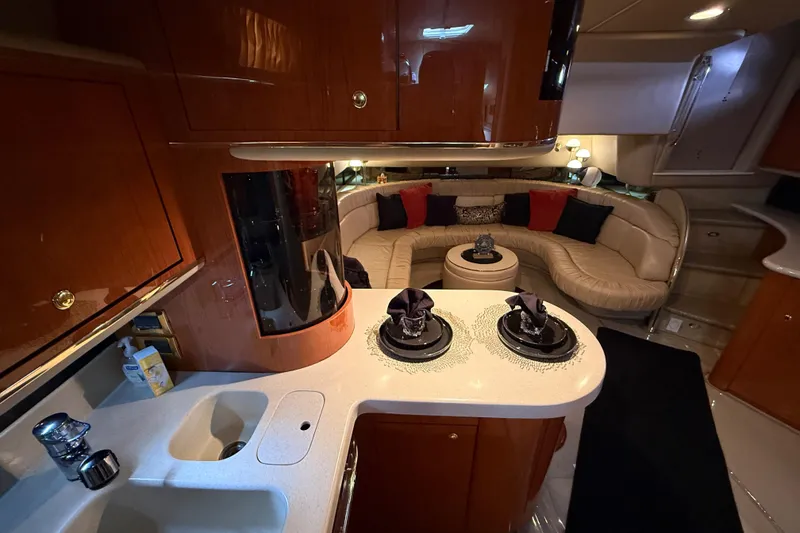 Slide: The Image of Luxurious interior of a 1998 Sea Ray 500 Sundancer yacht with elegant seating and modern amenities. - 54