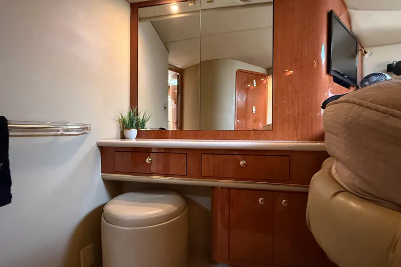 Slide: The Image of Interior of 1998 Sea Ray 500 Sundancer yacht with vanity, mirror, and seating. - 67