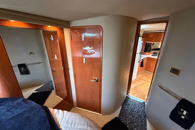 Slide: The Image of Luxurious interior of 1998 Sea Ray 500 Sundancer yacht, featuring wood finishes and modern amenities. - 68